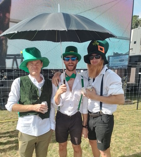 Image of three men dressed as Leprechauns at the Wildfoods Festival 2023